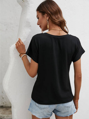 Black t-shirt with short sleeves and a draped knot front detail.