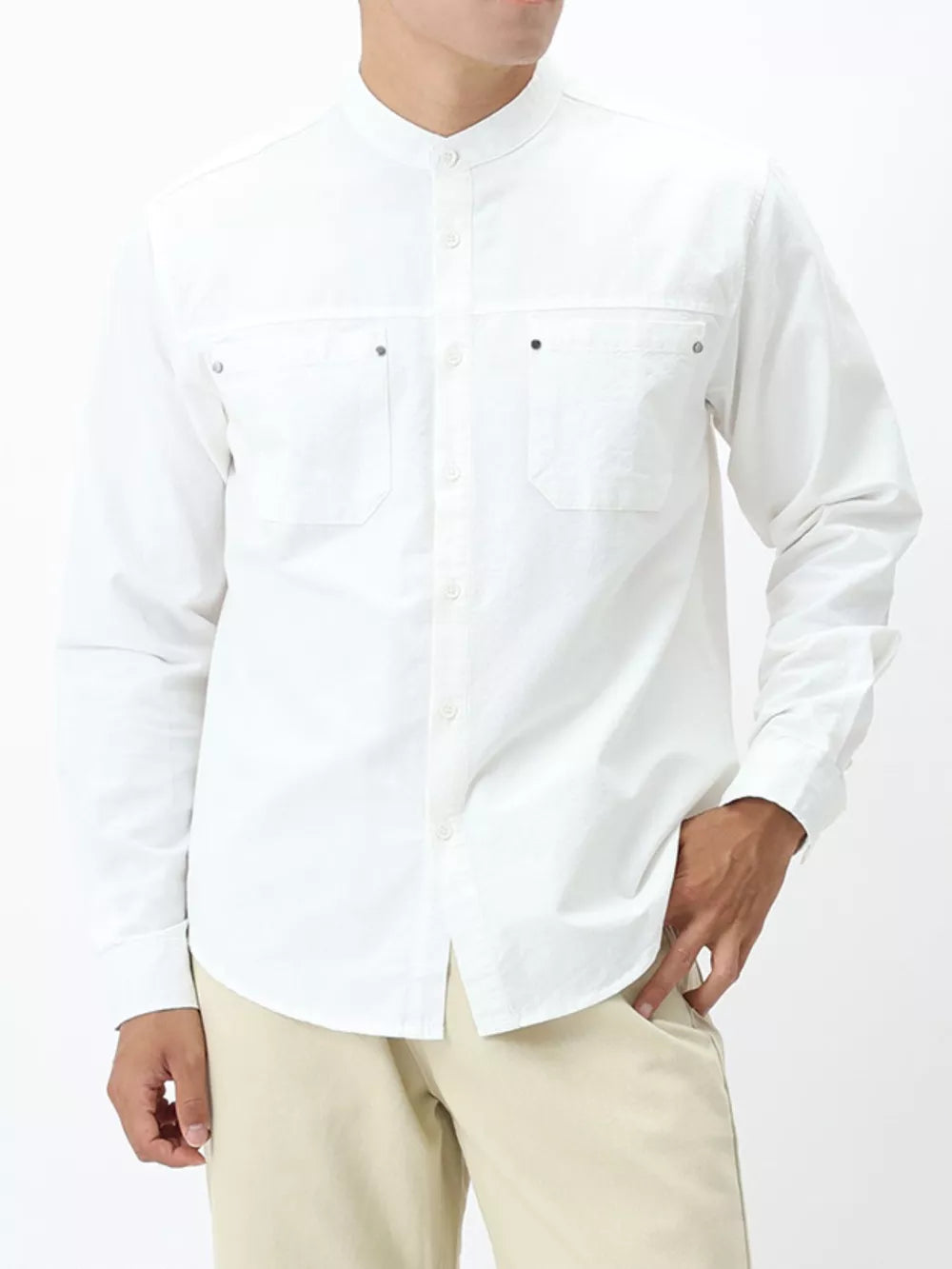 White cotton casual long sleeve shirt with button-down front and two chest pockets.