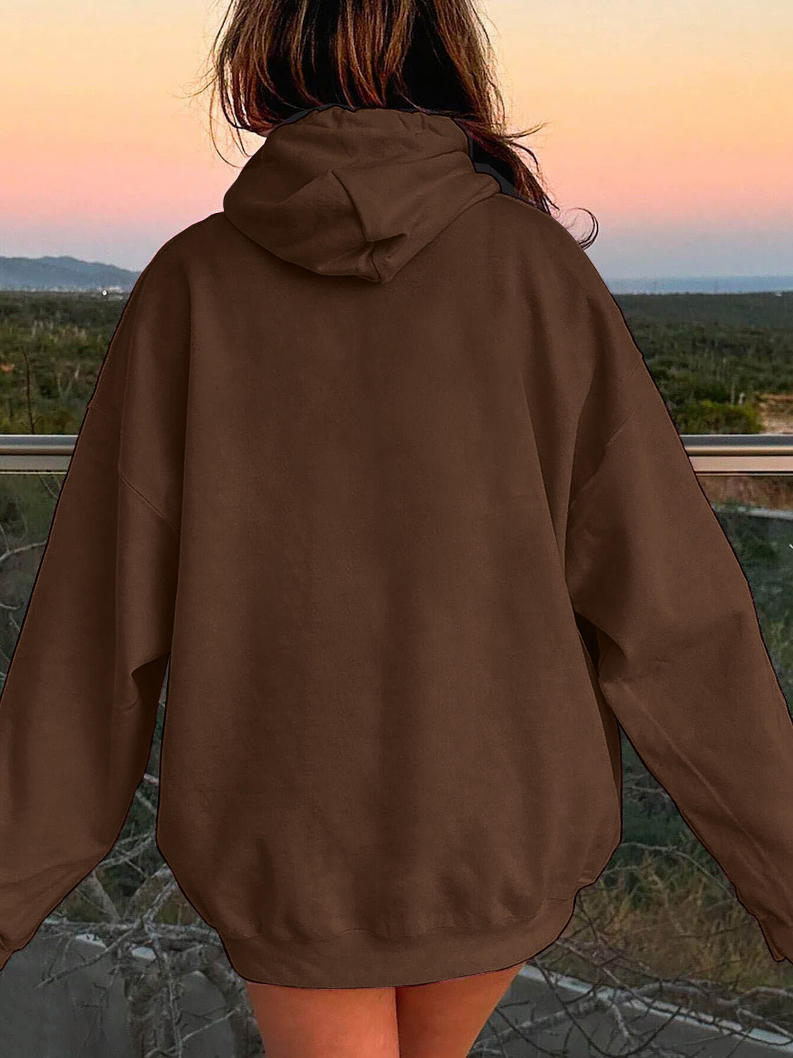 Oversized chocolate brown hoodie with pouch pocket and drawstring hood.