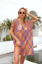 Open-knit caftan with V-neck, short sleeves, and slit hem in a multicolor pattern.