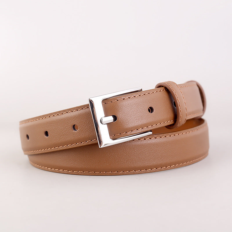 Timeless skinny leather belt in brown with a silver buckle and stitched detail.
