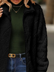 Black textured teddy zip-up jacket with a stand-up collar.