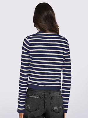 Navy and white striped cropped cardigan with long sleeves.