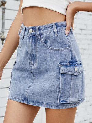 Medium wash denim mini skirt with cargo pockets and button closure