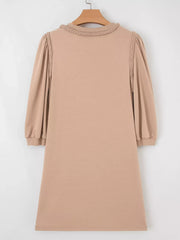 Braided puff sleeve khaki dress with braided neckline detail.