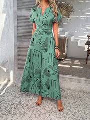 Geometric print wide-leg jumpsuit in Gum Leaf with V-neck and short sleeves.