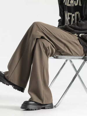 Relaxed fit wide-leg men's sweatpants in coffee color, styled casually.