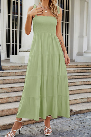 Light green tiered ruffle smocked bodice maxi dress with tie straps.