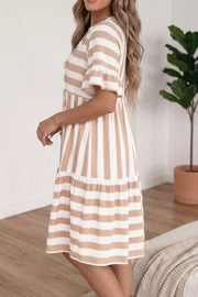 Chic striped v-neck flared summer dress with button detail and ruffled sleeves.