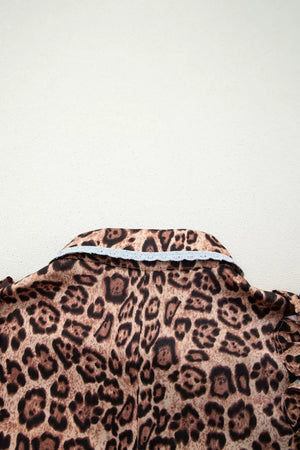 Leopard print cotton mini dress with lace-trimmed collar and button front.