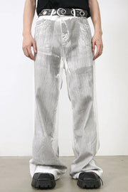 Metallic panel wide leg trousers in light, featuring a textured metallic finish and a relaxed fit.