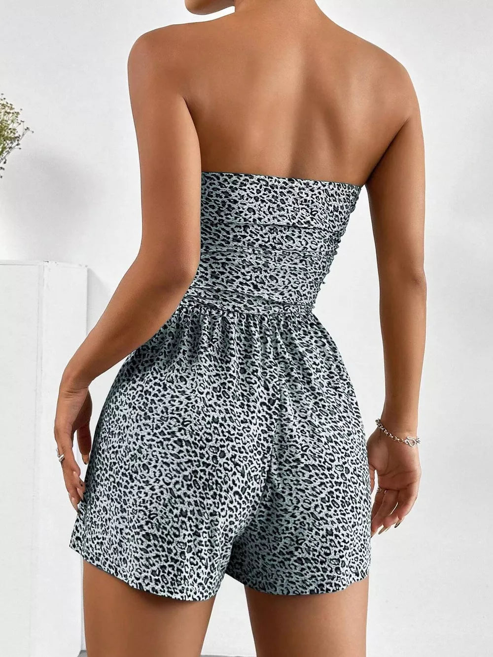 Strapless ruched waist romper in leopard print with ruched bodice and elastic waist