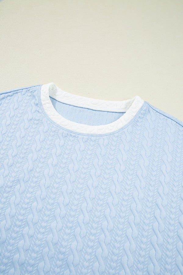 Light blue loungewear set with cable knit texture and white trim neckline