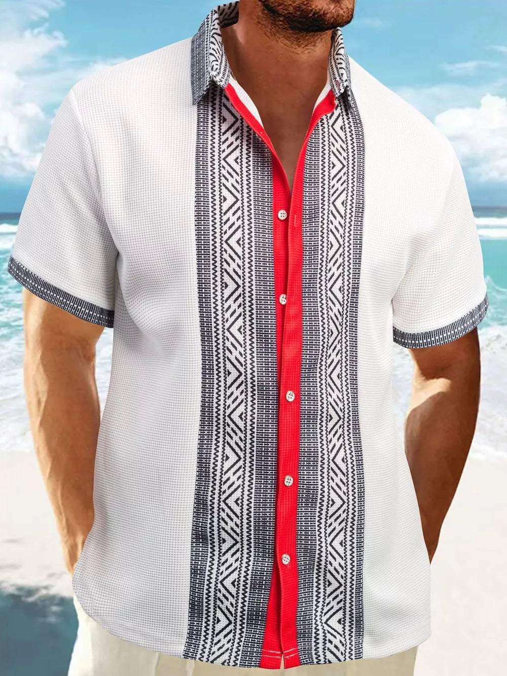 Men's white short sleeve shirt with bold geometric print panels and red trim.