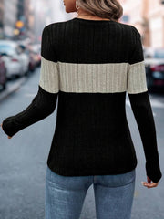Ribbed crewneck sweater in black and beige colorblock with long sleeves.