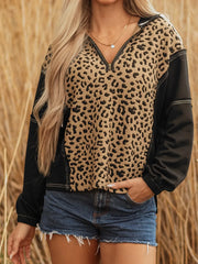 Leopard print zip hoodie with black sleeves and contrast stitching.