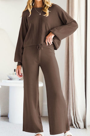 Brown knit loungewear set with wide-leg pants and balloon sleeves