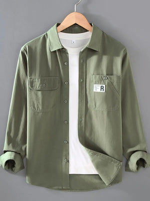 Men's gray green cotton long-sleeve overshirt with two chest pockets and button closure.