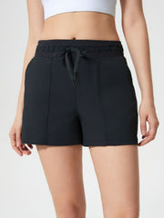 Black utility shorts with drawstring waist and textured fabric detail.