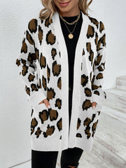 Leopard print open-front knit cardigan with white trim and pockets.