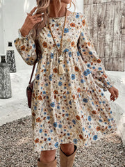 Floral tiered hem long sleeve dress with ruffled cuffs and a boho print.