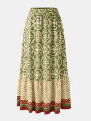 Tiered maxi skirt in green with medallion print and elastic waist.