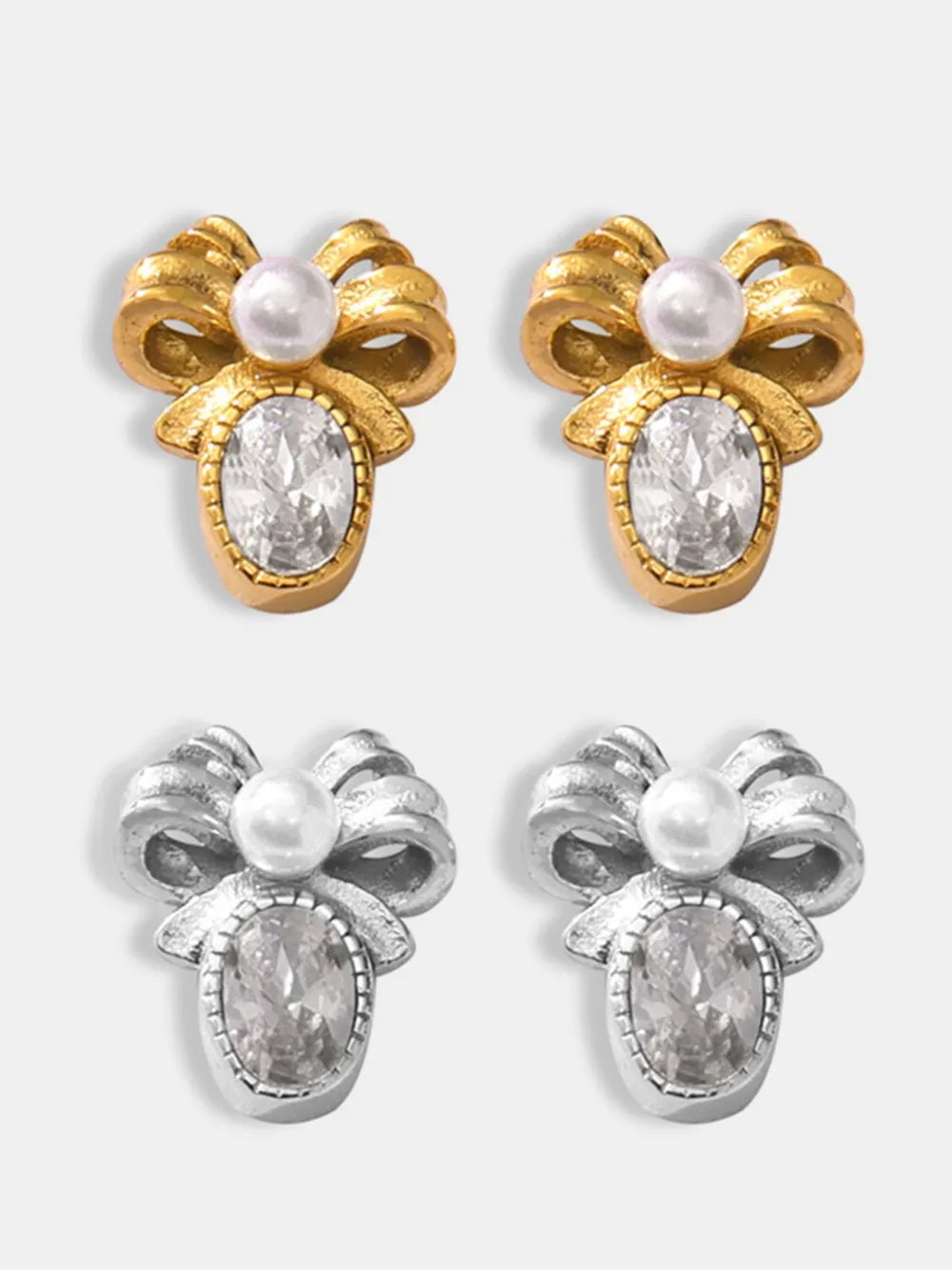 Gold and silver bow stud earrings with pearl and oval crystal details