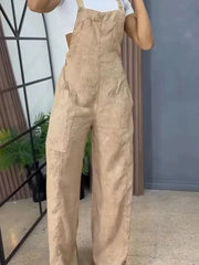 Khaki denim wide-leg overalls with bib front and large pockets.
