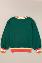 Dark green knit sweater with balloon sleeves and colorblock trim at neckline and hem.