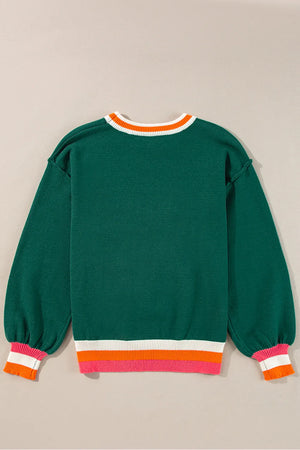 Dark green knit sweater with balloon sleeves and colorblock trim at neckline and hem.
