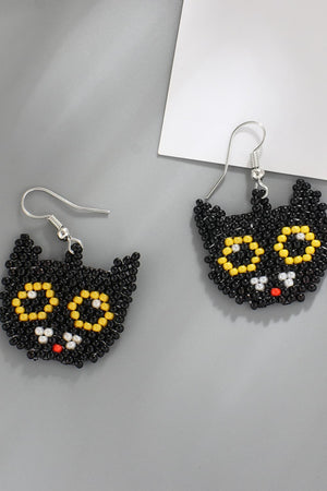 Black cat beaded earrings with yellow eyes and red nose.