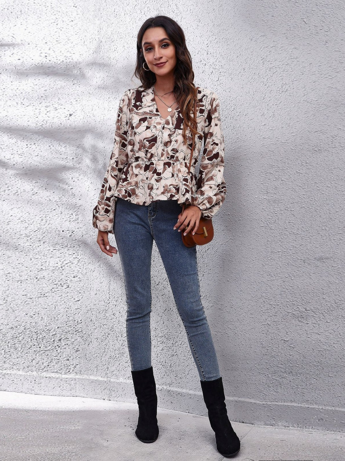 Beige floral peplum blouse with gathered waist and V-neck
