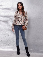 Beige floral peplum blouse with gathered waist and V-neck