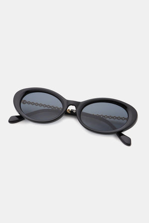 Black oval sunglasses with chain detail on lenses and temples.