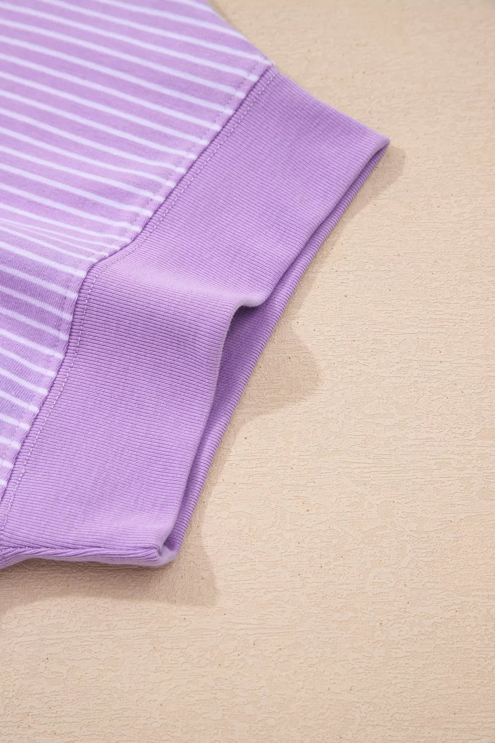 Purple and white striped cotton shorts with a ribbed waistband detail.