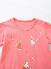 Coral t-shirt with fairy and butterfly print, short puff sleeves, and crew neck.