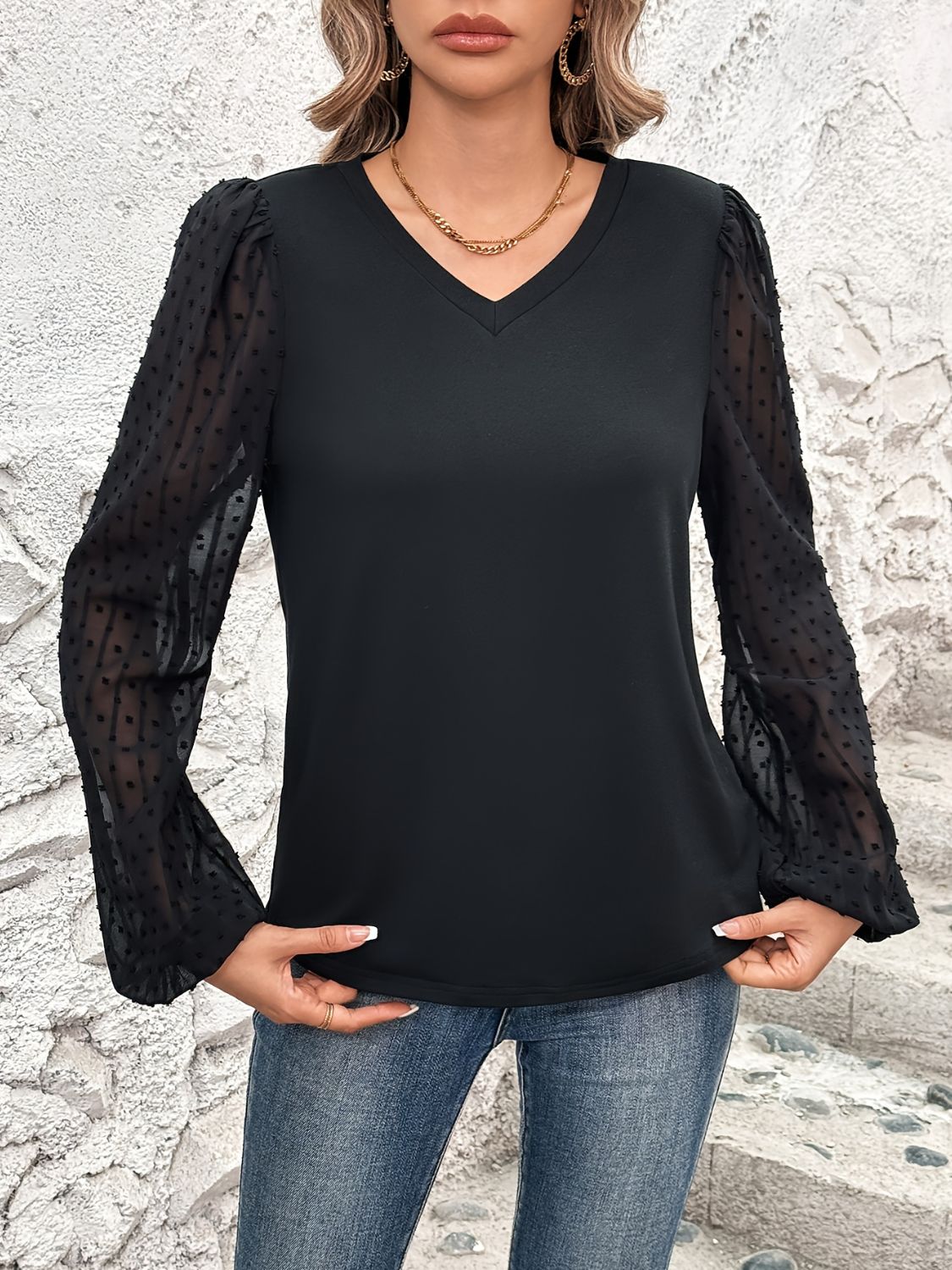 Black V-neck blouse with sheer dot puff sleeves