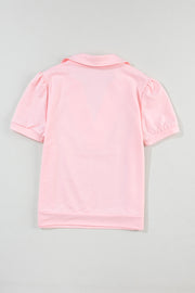 Blush pink V-neck collar tee with short puff sleeves and a casual fit.