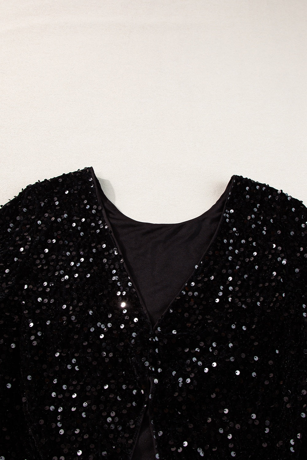 Black sequin backless blouse with V-neckline detail