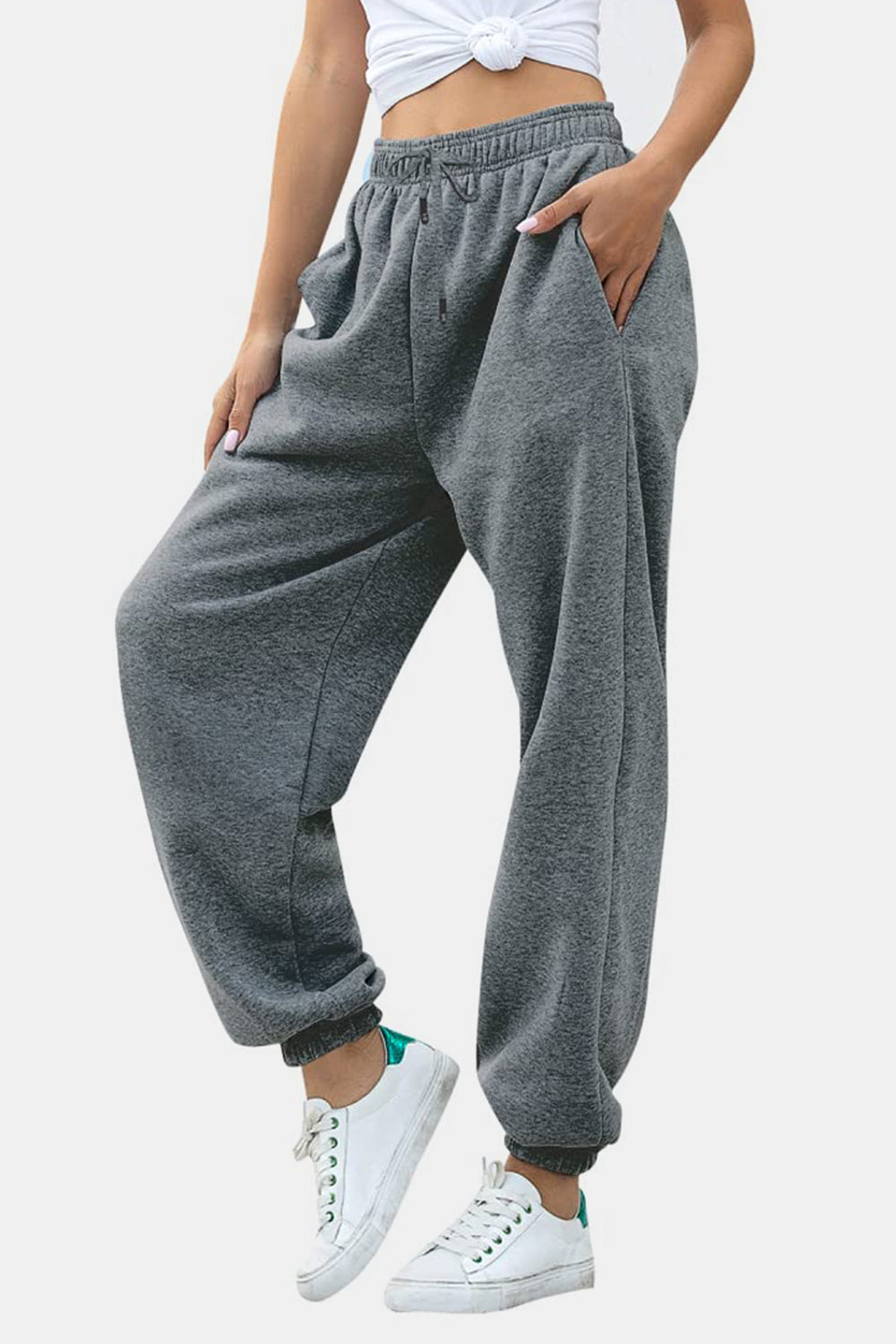 Relaxed-fit gray sweatpants with cuffed ankles and drawstring waist.