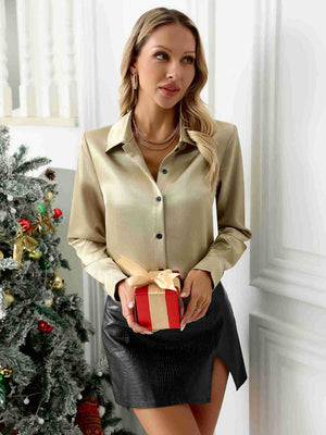 Gold satin button-down blouse with black buttons, styled with a black mini skirt.