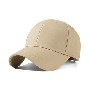 Minimalist cotton baseball cap in beige with a curved brim.