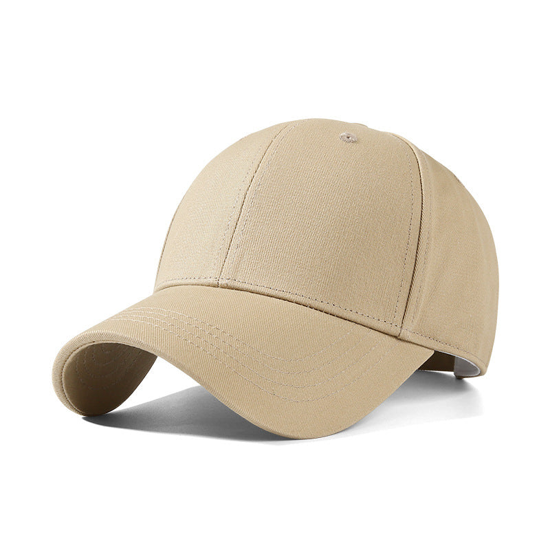 Minimalist cotton baseball cap in beige with a curved brim.