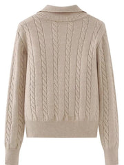 Beige cable knit quarter-zip pullover sweater with a ribbed collar and cuffs.