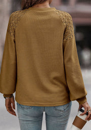 Camel waffle knit raglan top with lace yoke detail and balloon sleeves.