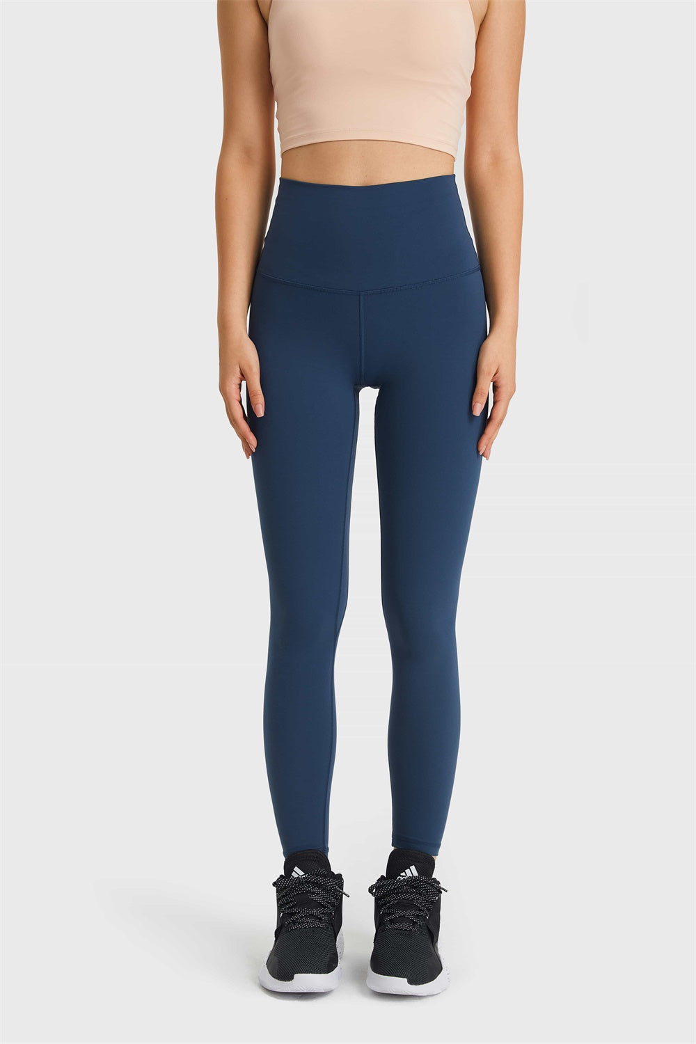 Navy high rise leggings with a seamless waistband and full length.