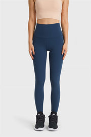 Navy high rise leggings with a seamless waistband and full length.