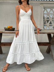 White lace tiered maxi dress with scalloped neckline and spaghetti straps.