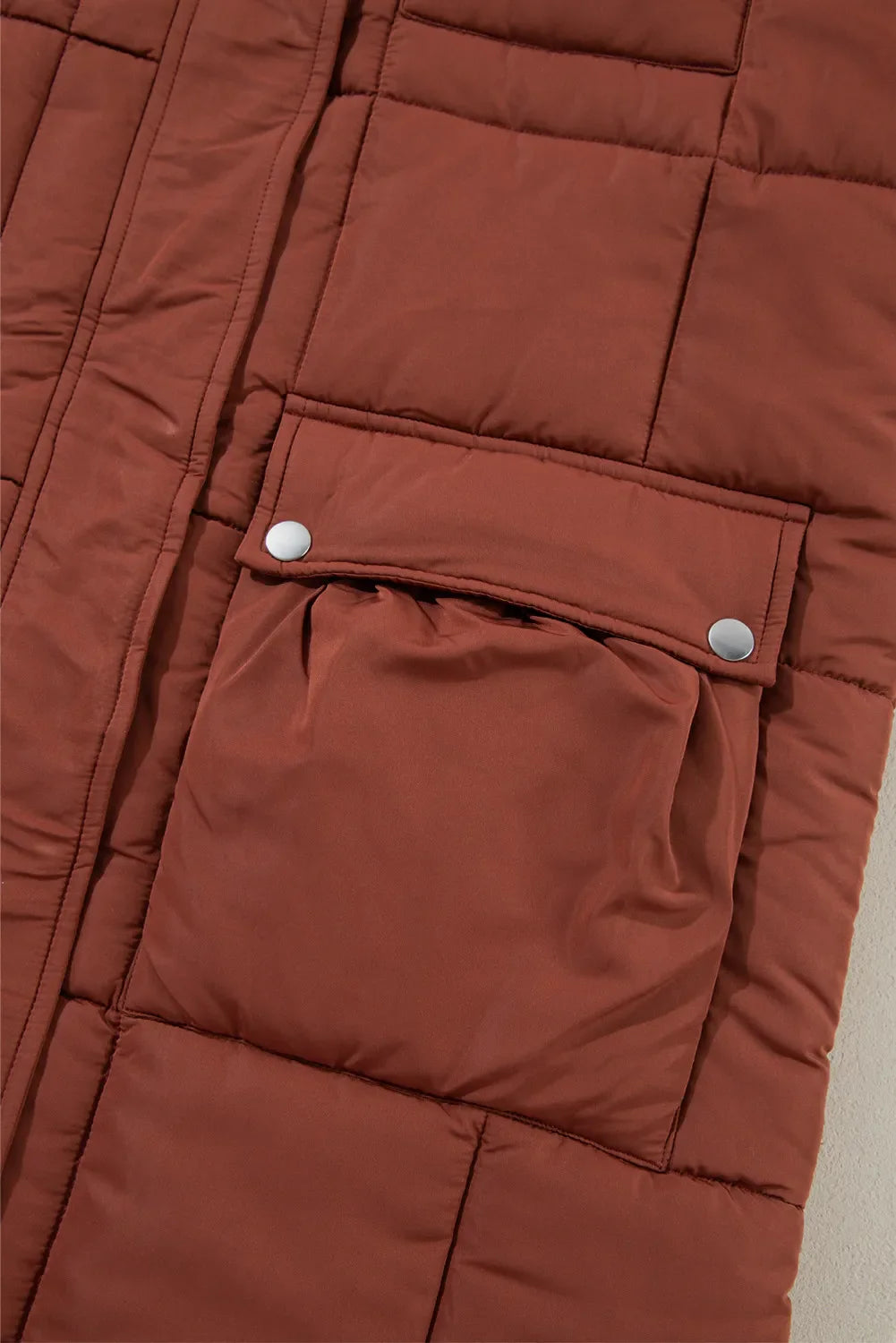 Brown quilted longline puffer coat with snap patch pockets