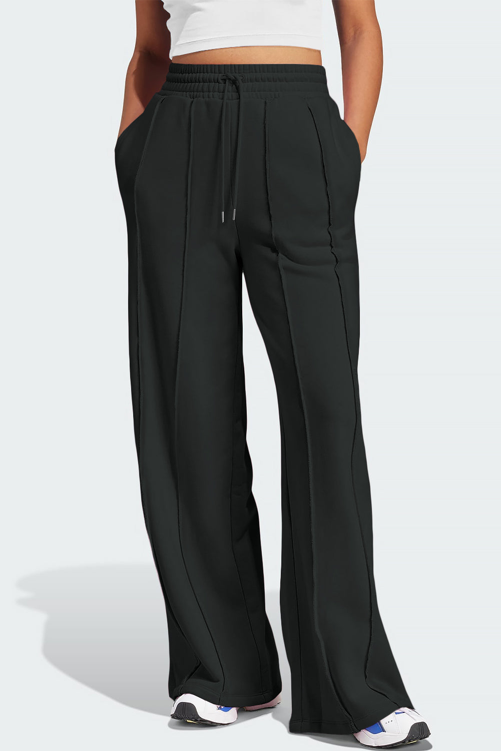 Black seamed wide leg lounge trousers with drawstring waist and pockets.
